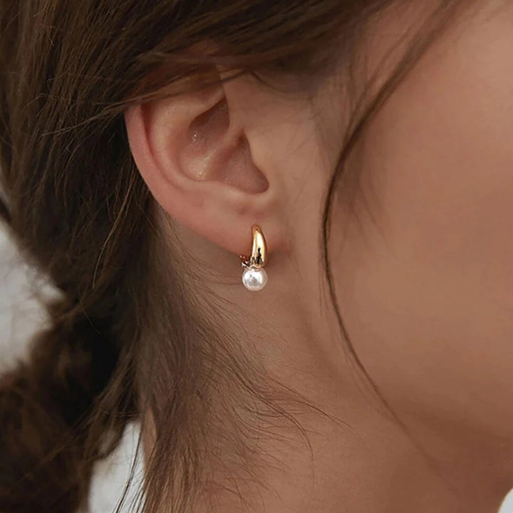 Boucles d'oreilles élégantes en perles dorées