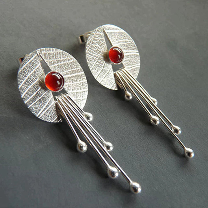 Boucles d'oreilles élégantes et exquises en pierre rouge