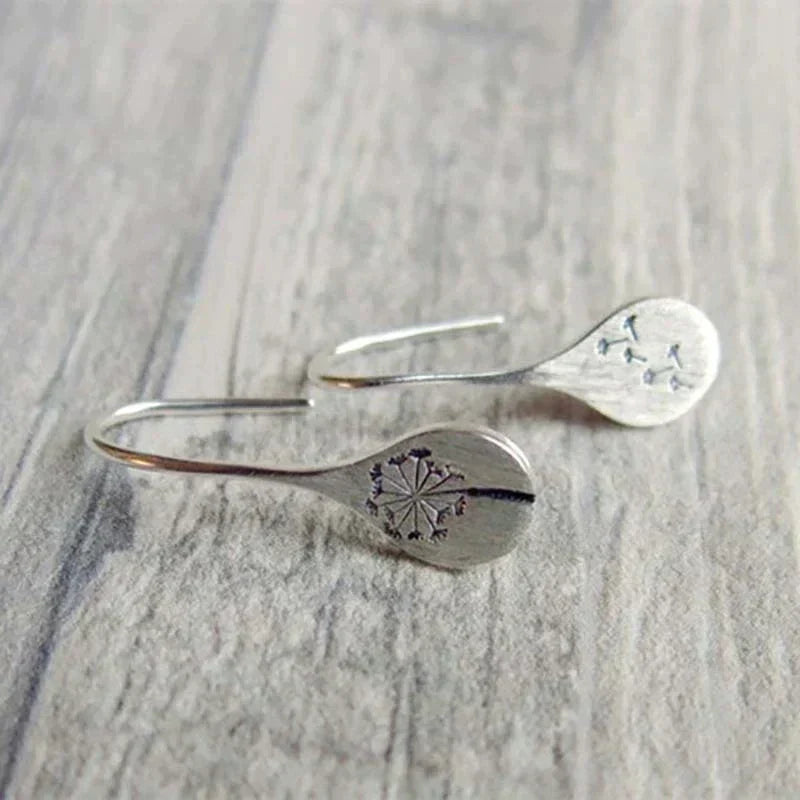 Boucles d'oreilles vintage en argent avec motif floral