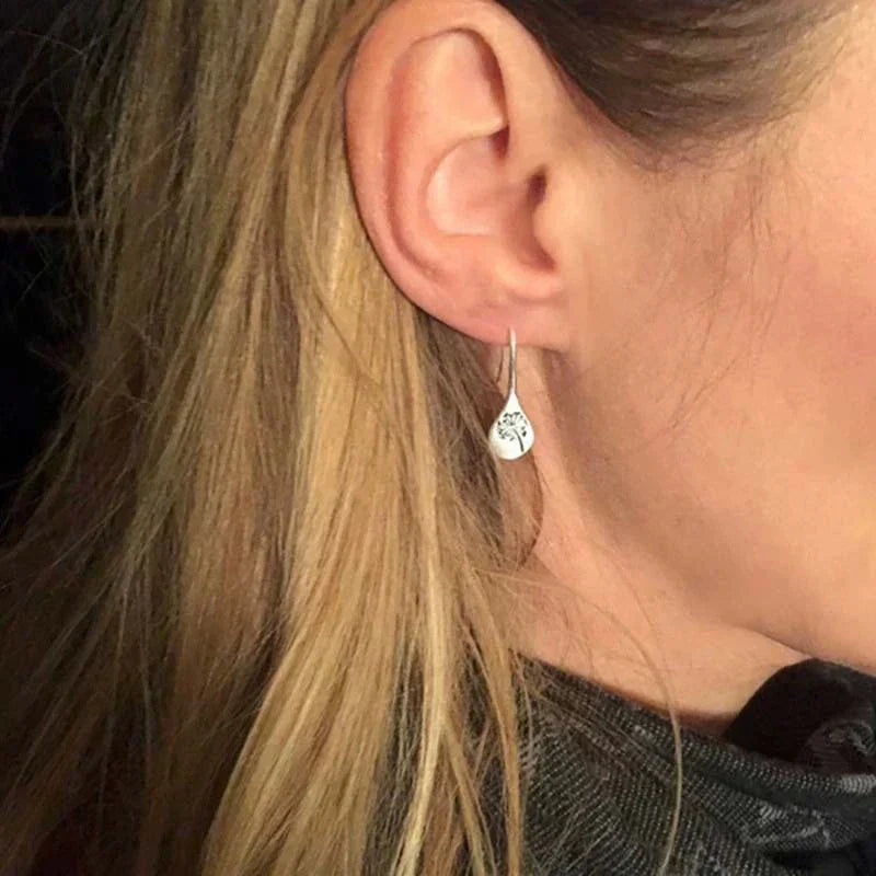 Boucles d'oreilles exclusives en argent avec feuilles de dent de lion
