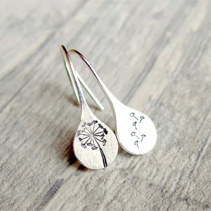 Boucles d'oreilles exclusives en argent avec feuilles de dent de lion