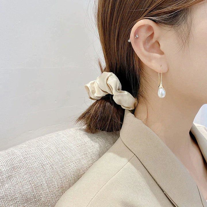 Boucles d'Oreilles Élégantes en Forme de Goutte Ornée de Perles pour un Style Sophistiqué