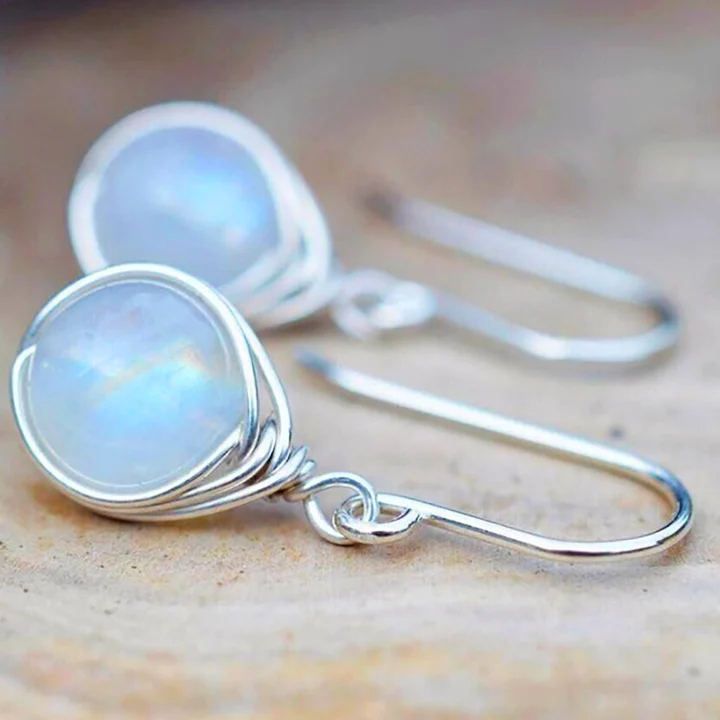 Boucles d'oreilles élégantes en argent et pierre de lune pour un look intemporel
